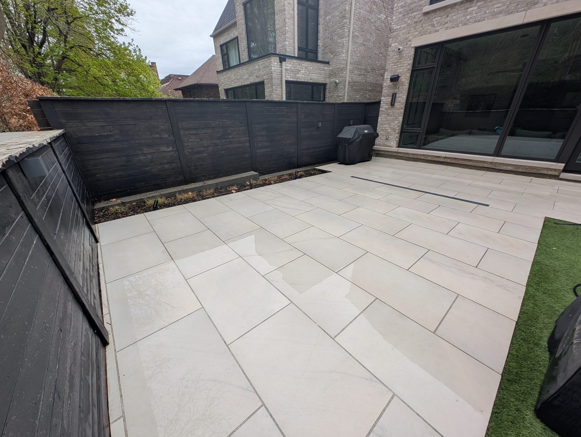 After: A clean stone patio restored by Ace Power Washing after removing winter deposits and stubborn stains in South Hill