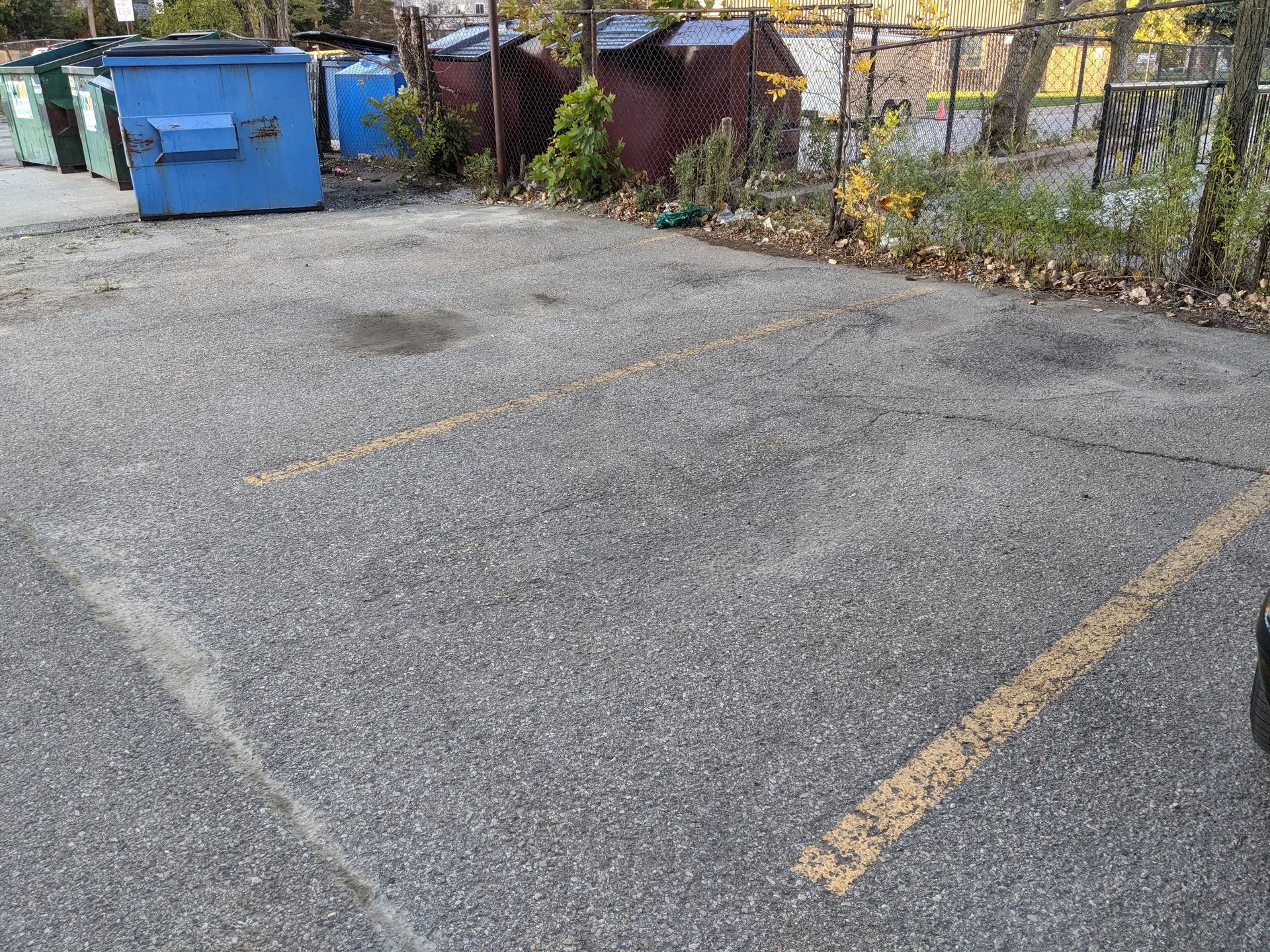 Clean and clear retail parking stalls after professional power sweeping and debris removal service