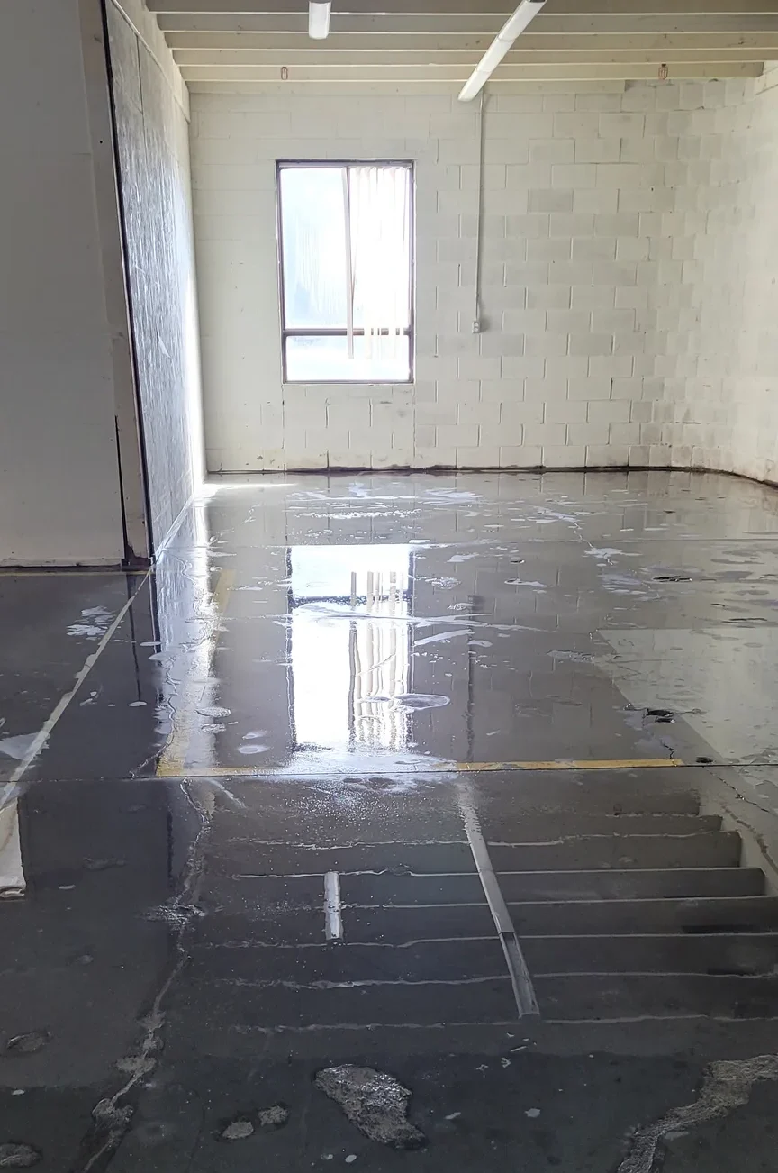 Deep cleaning of an industrial warehouse floor to restore a professional, clean environment