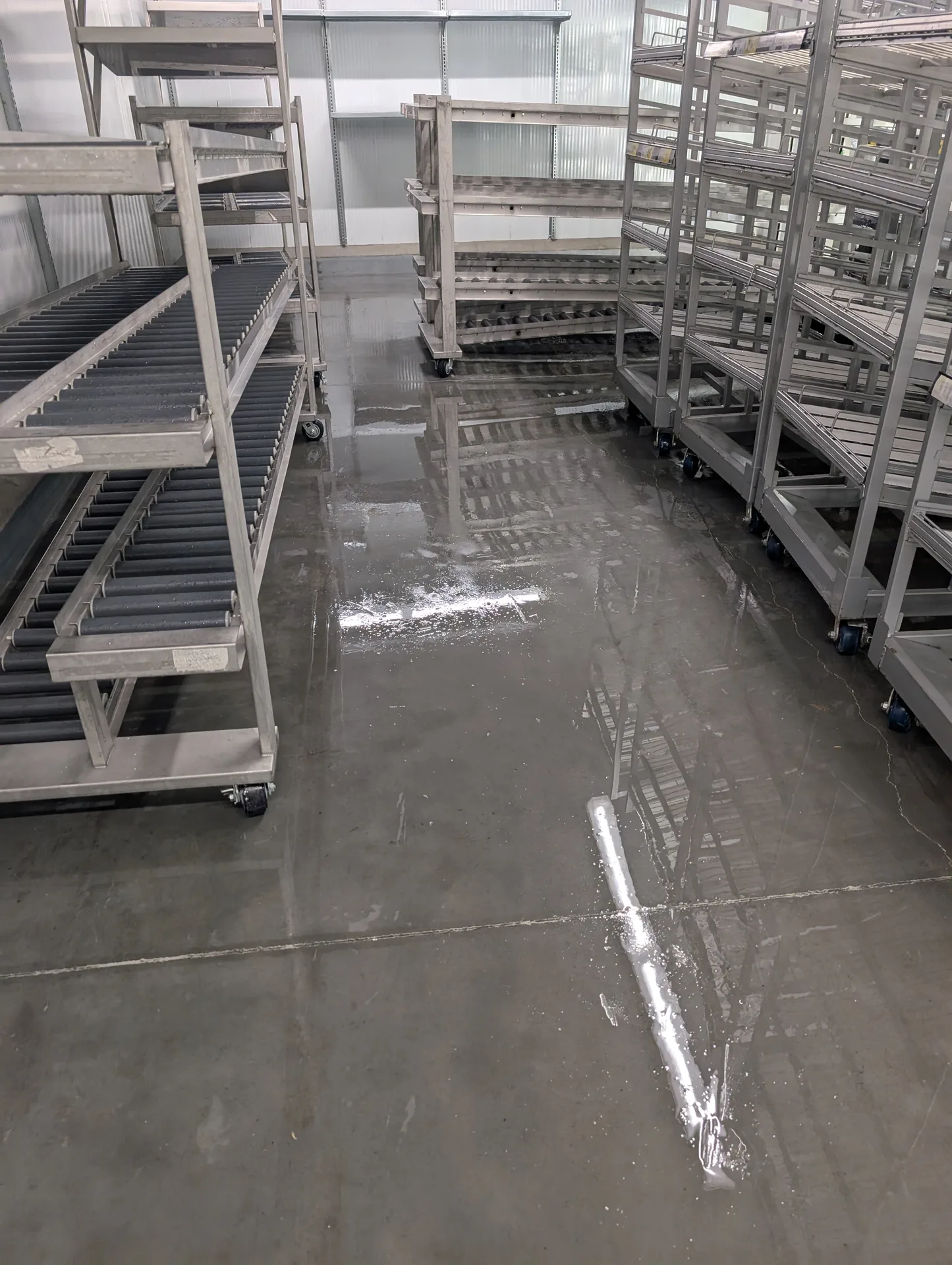 Food-safe floor scrubbing by Ace Power Washing to prepare commercial cold storage for inspection