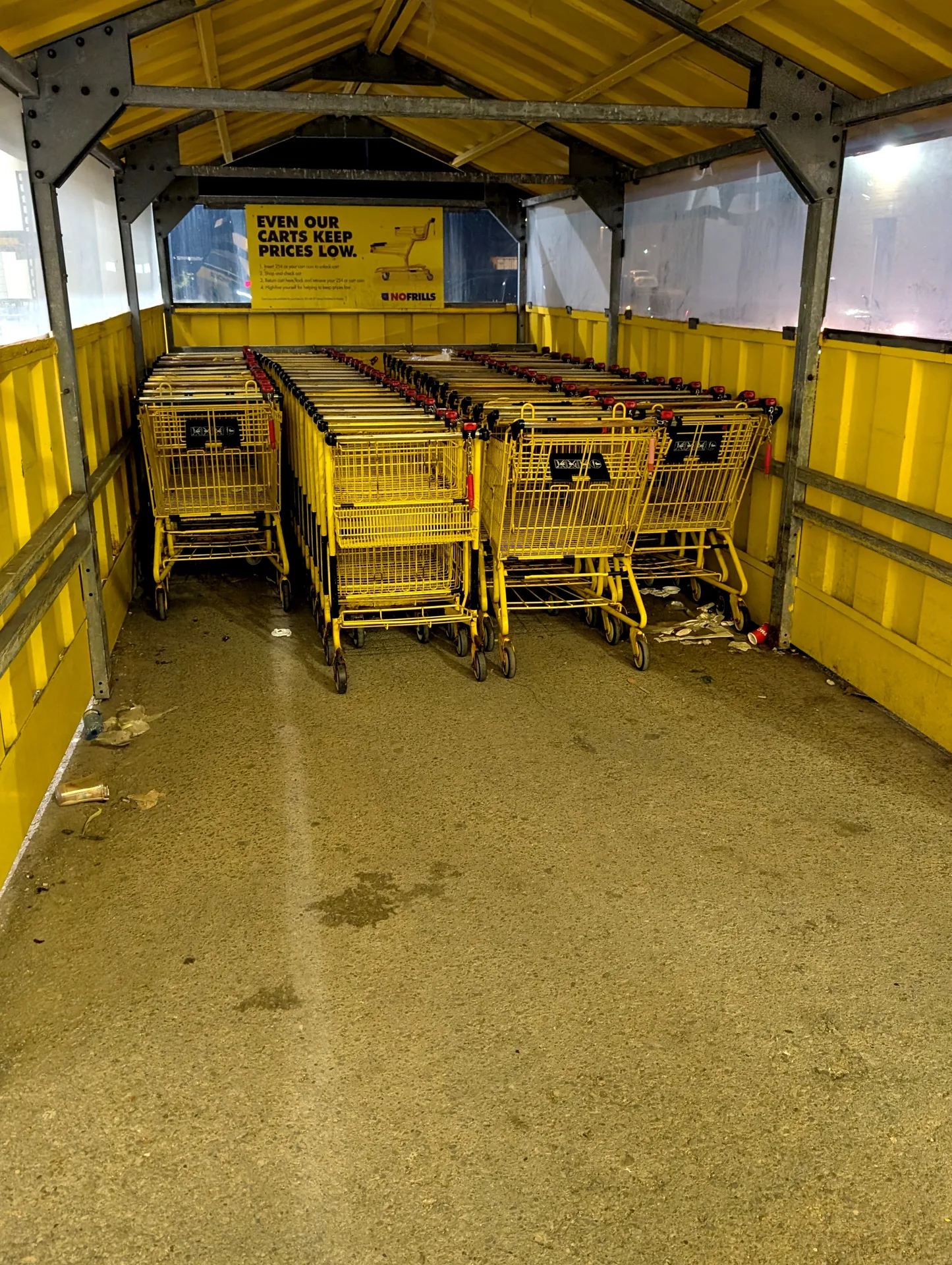 Ace Power Washing: Before photo of a retail shopping cart corral with litter and surface grime