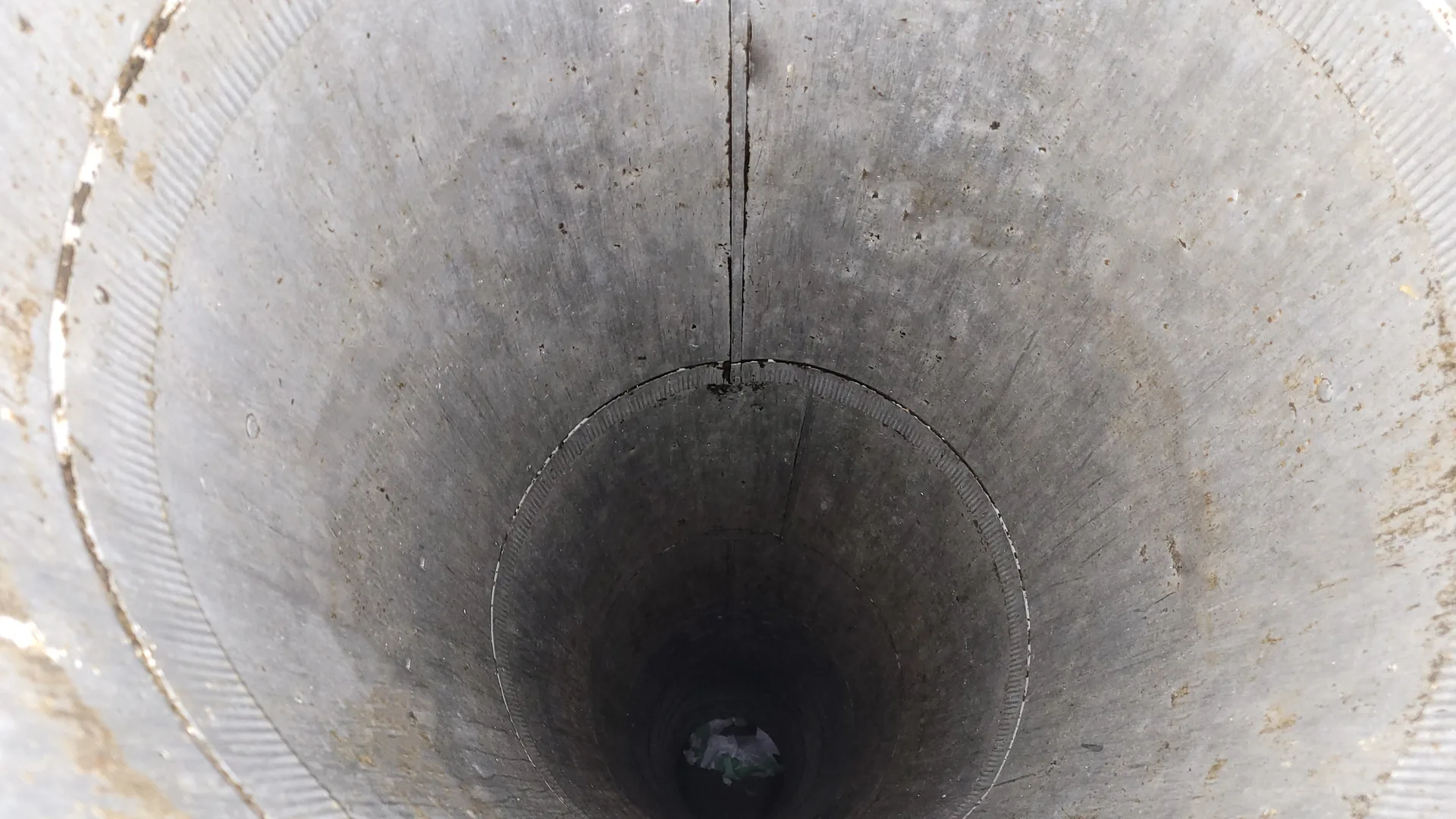 Cleaned and degreased garbage chute lining following a professional high-pressure spinner wash