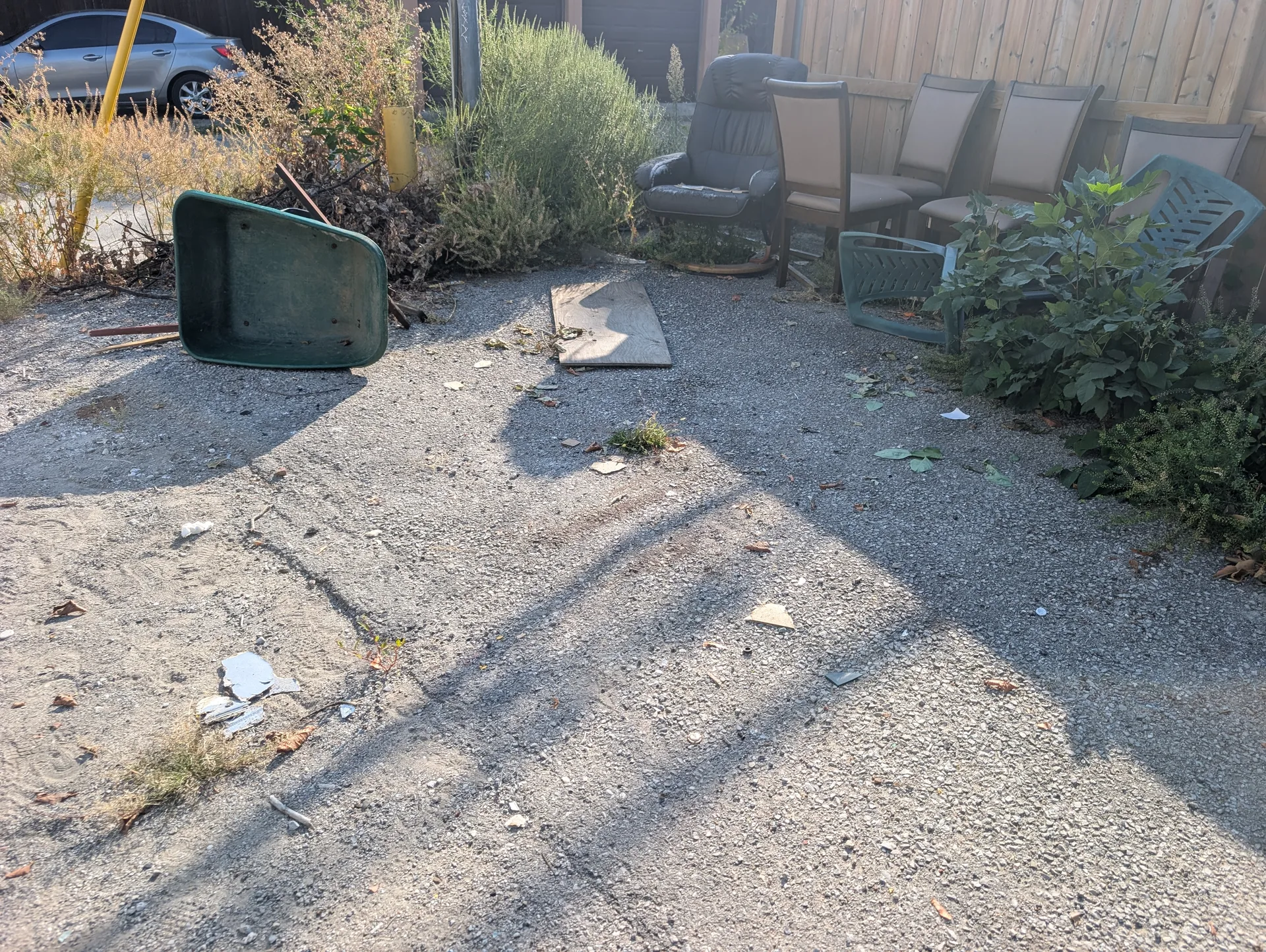 Abandoned furniture and residential junk on estate grounds prior to ACE professional hauling