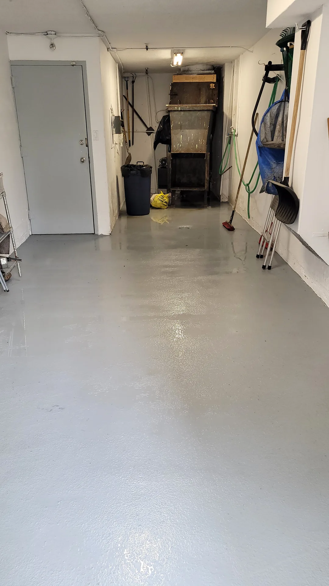 Fully sanitized and restored garbage room floor by Ace Power Washing, eliminating odors and bacteria