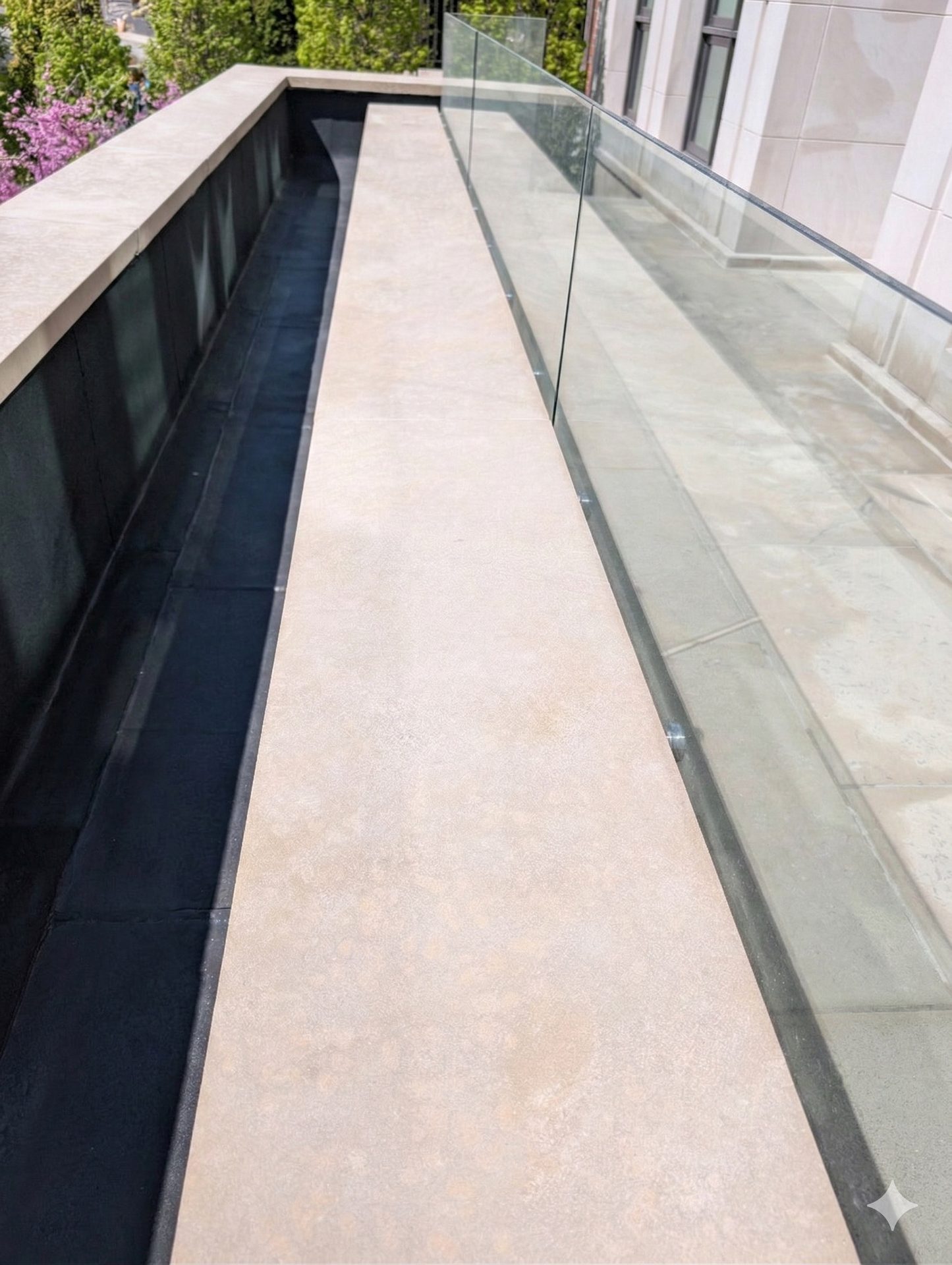 After: Pristine Indiana limestone planter restored to natural beauty by ACE, eliminating black lichen stain in Caribou Park