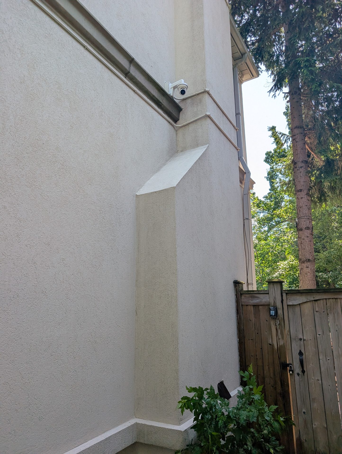 After: Restored stucco exterior in Erin after ACE safely removed heavy algae stain with a professional eco-friendly soft wash