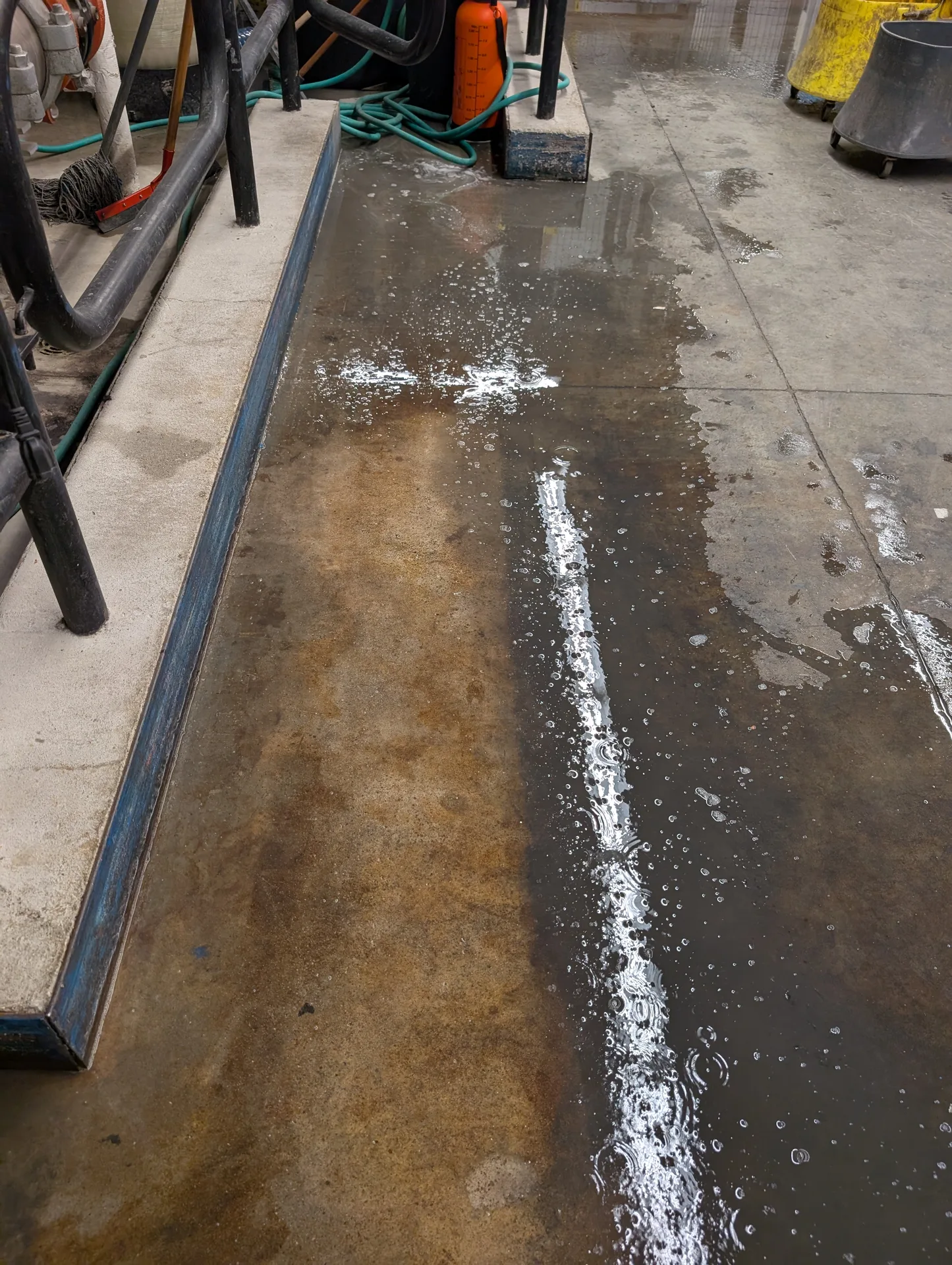 Industrial floor degreasing and rust removal by Ace Power Washing for commercial facility maintenance