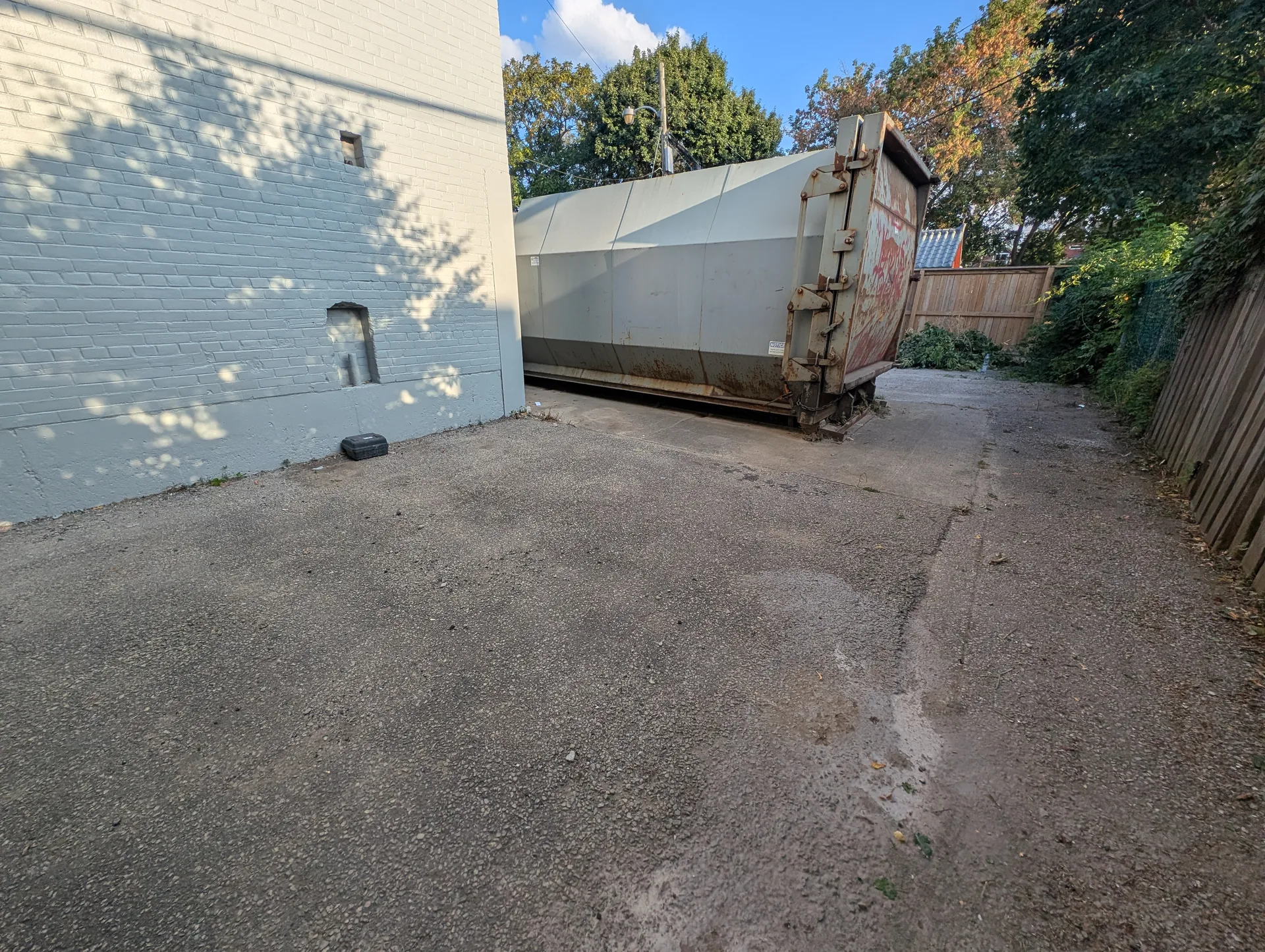 Compactor area power swept, lot restored to an orderly condition by ACE professional site sweeping.