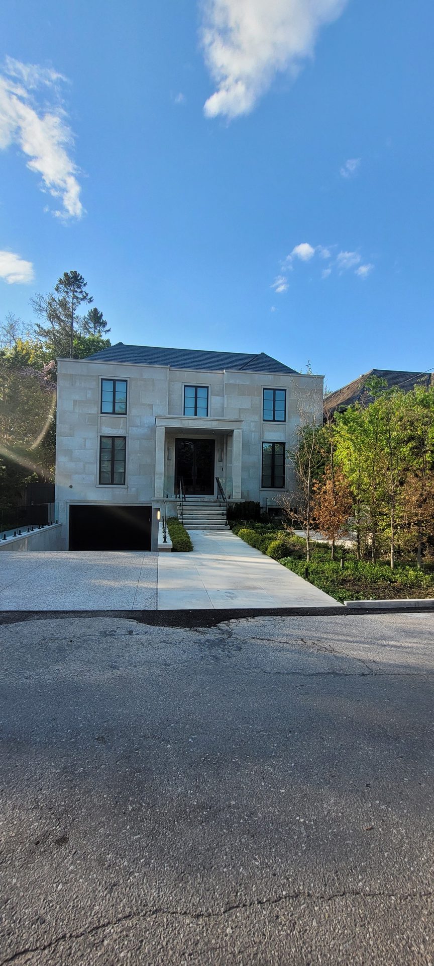 Heavy post-construction mortar smears on a classic limestone estate elevation in Lawrence Park prior to ACE chemical treatment