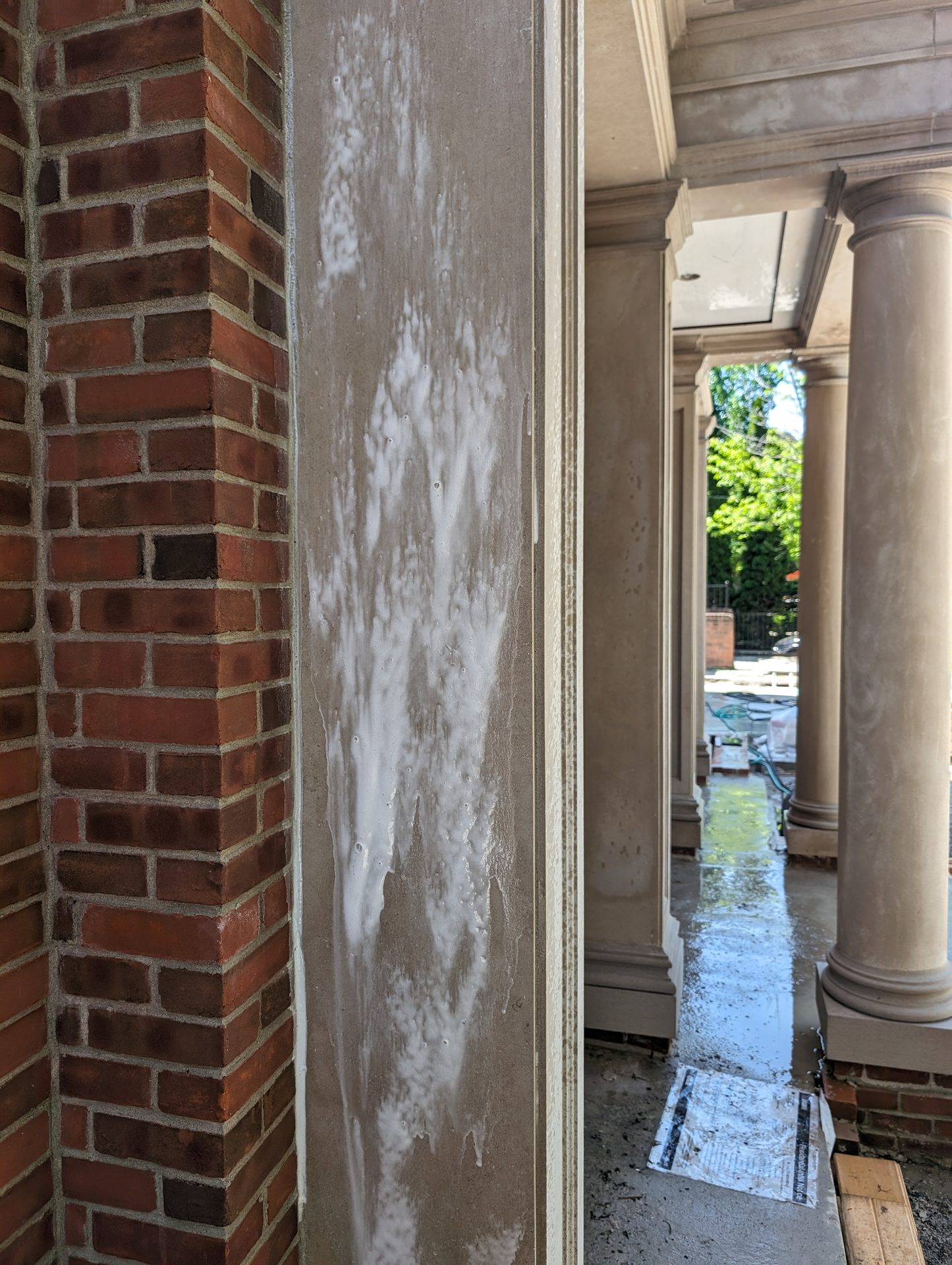 Mortar smear on limestone pilaster, Allenby – Ace Power Washing
