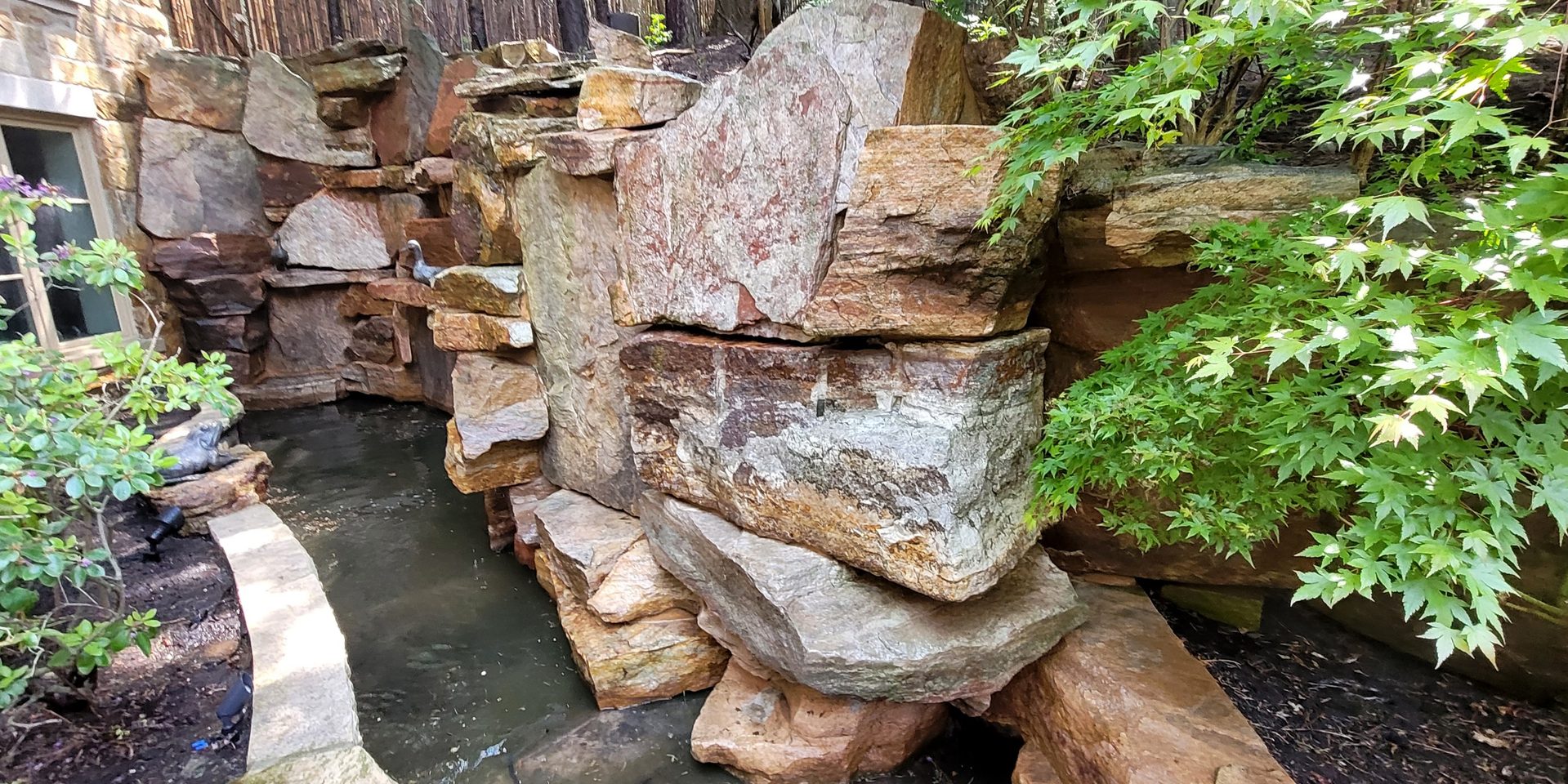 Estate stone waterfall in York restored to its original brilliance through ACE professional chemical cleaning