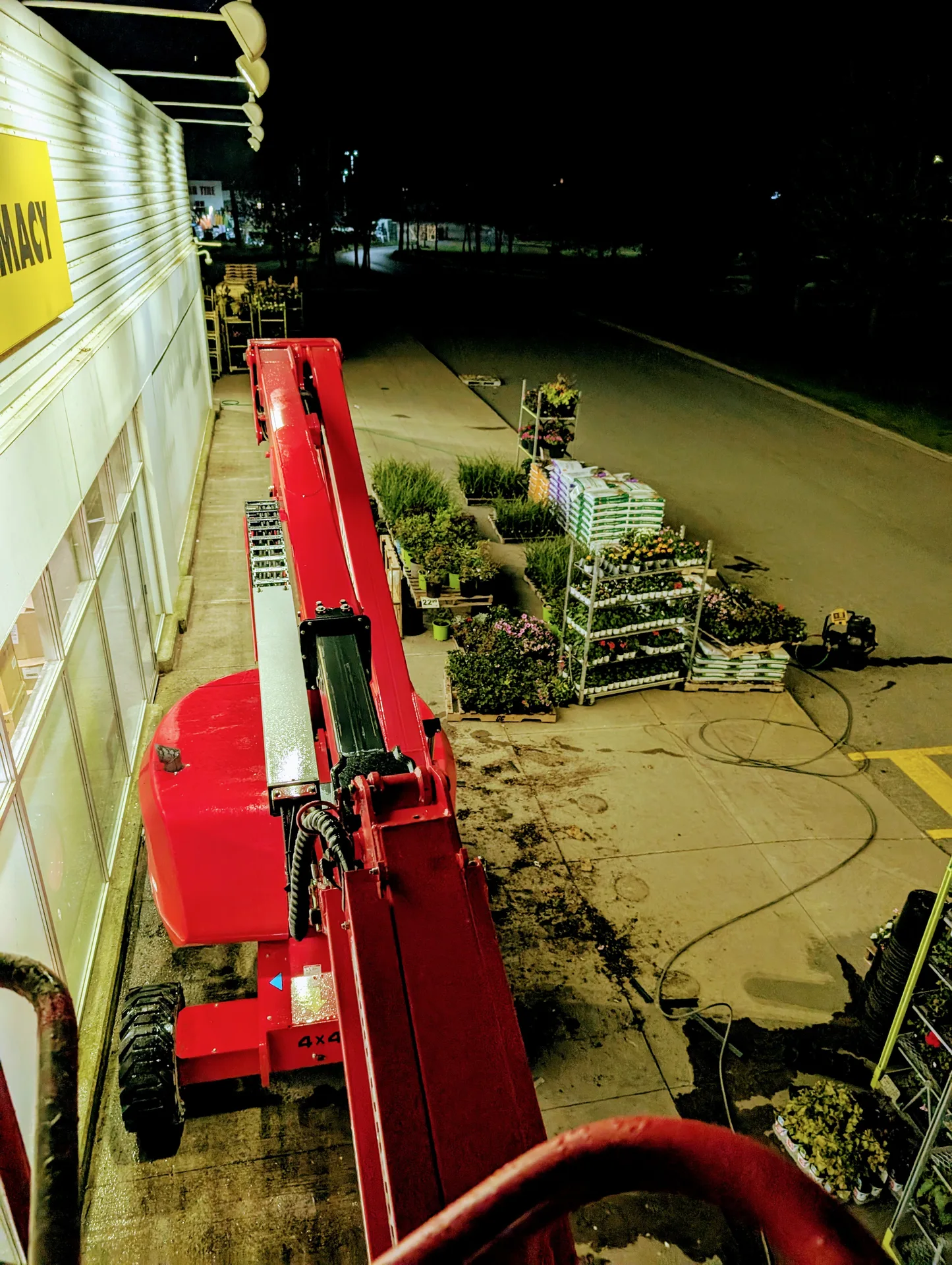 Nighttime storefront cleaning with professional aerial equipment to minimize business disruption