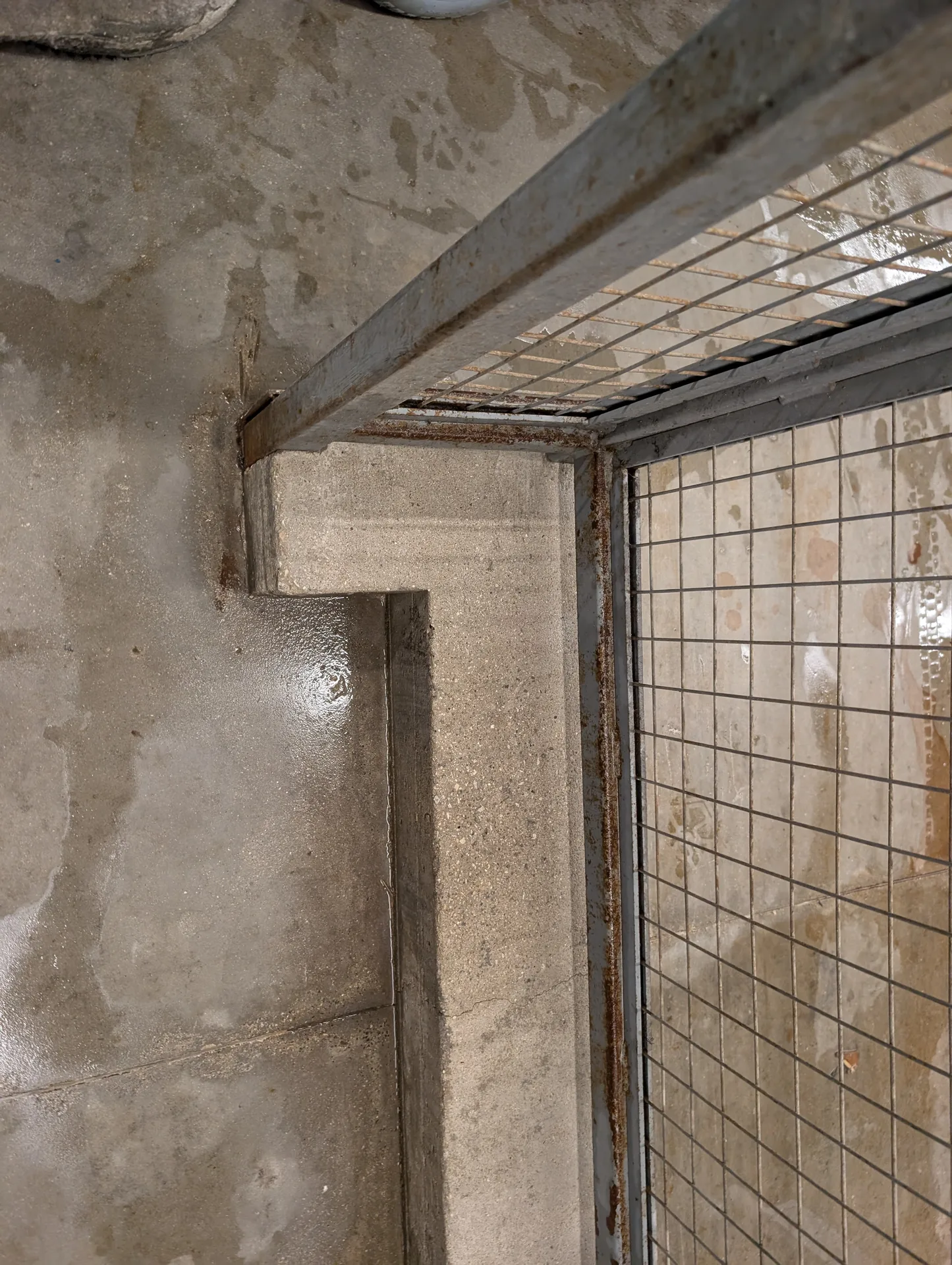 Sanitized concrete ledge and warehouse floor after professional deep cleaning and pressure wash