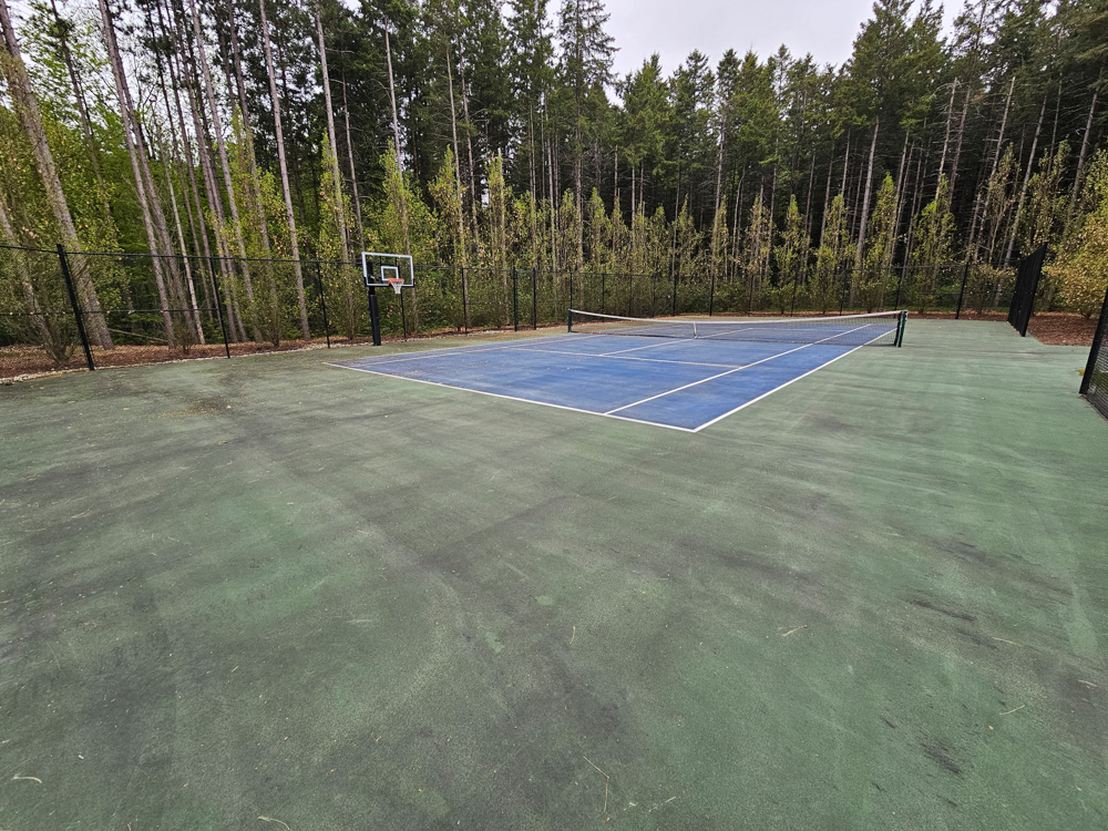 GTA estate tennis court before pressure washing — heavy algae and grime build-up on surface