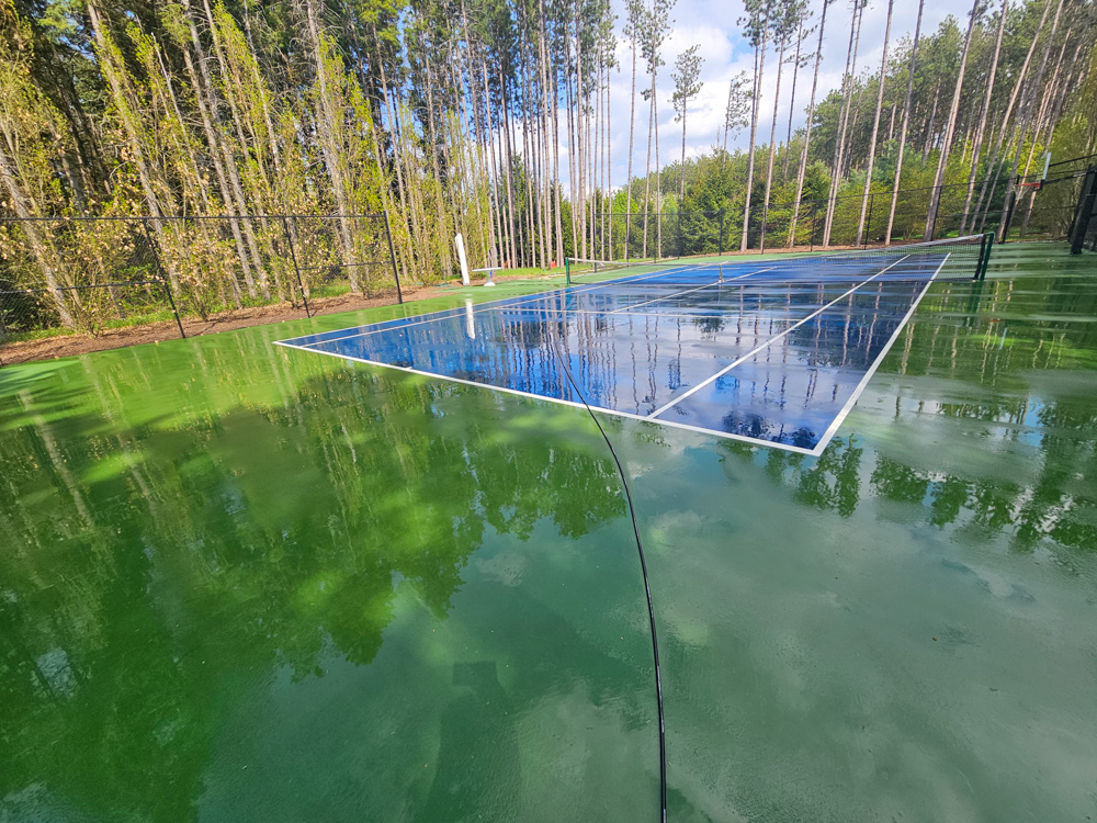 GTA estate tennis court fully restored after professional pressure washing — clean surface, sharp lines