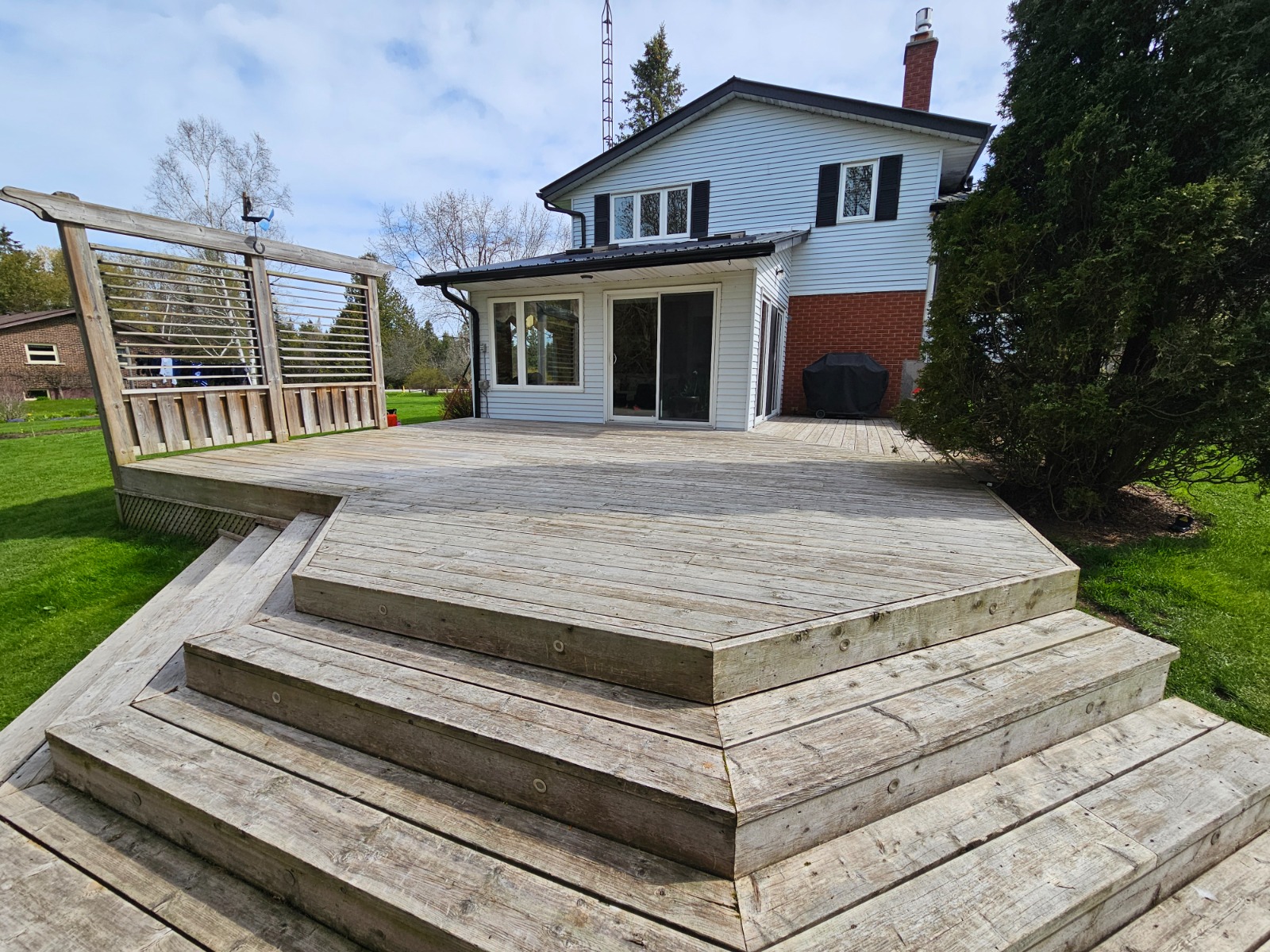 Before: Backyard deck in Guelph before power washing